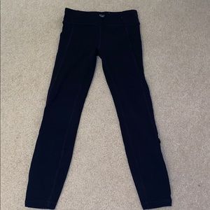 Athleta black leggings with cross ties at bottom